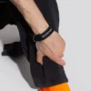 Bracelet à pièces avec logo « Noir » 656450-TZ10Z-1268
