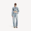 Jean femme à coutures torsadées, bleu clair délavé Jean femme à coutures torsadées, bleu clair délavé