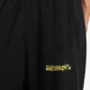 Pantalon de survêtement baggy pour homme noir avec motif « messy spray » Pantalon de survêtement baggy pour homme noir avec motif « messy spray »