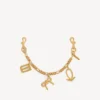 Porte-clés pour femme avec breloques dorées Porte-clés pour femme avec breloques dorées