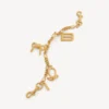 Porte-clés pour femme avec breloques dorées Porte-clés pour femme avec breloques dorées