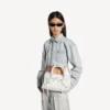 Sac City pour femme, petit modèle à clous géants et strass, blanc optique Sac City pour femme, petit modèle à clous géants et strass, blanc optique
