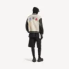 Veste universitaire pour homme Balenciaga | Collaboration NBA, couleur ivoire Veste universitaire pour homme Balenciaga | Collaboration NBA, couleur ivoire